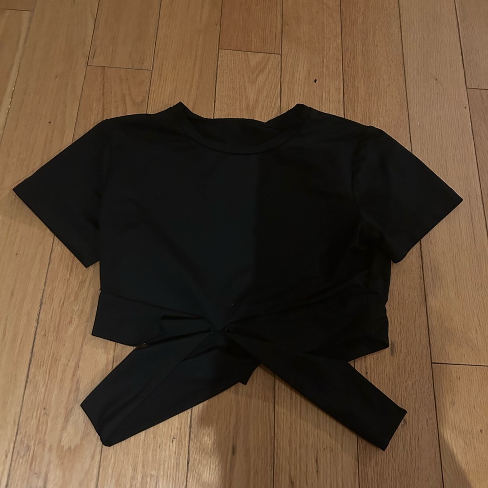 Black workout too with criss cross strap detail on the front size small US